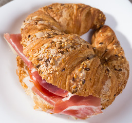 sandwich made with croissant cheese and Parma ham