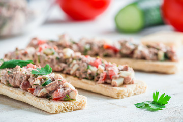 homemade healthy open sandwiches with crispbread tuna salad tomatoes cucumber boiled egg on white table close up