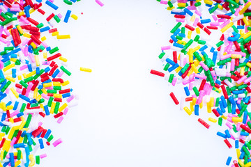 Colorful candy sprinkles close up for birthday cake on white background