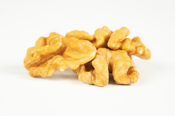 Walnuts isolated on white background. Pile of walnuts without shell closeup for your design and print. Nuts collection