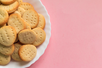 Sweet healthy homemade cookies on a white plate isolated, picture with space for text