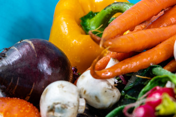 Colourful assorted raw vegetables on a wooden cutting board. Calgary, Alberta, Canada