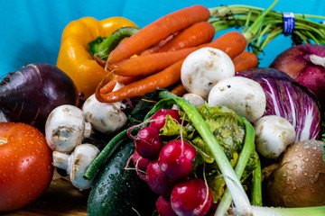 Colourful assorted raw vegetables on a wooden cutting board. Calgary, Alberta, Canada