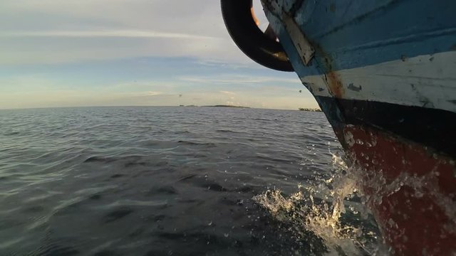 Traditional fisherman boat Splash in the ocean