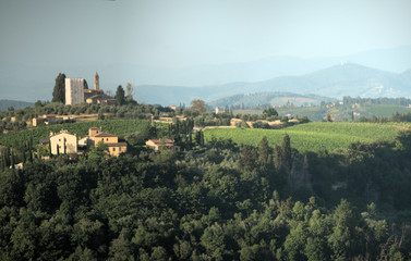 Fototapeta na wymiar Hillside settlement in the agricultural landscape of Tuscany near Florence