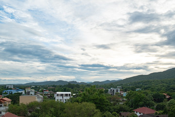 Fototapeta na wymiar landscape aerial view of building in city nearby the mountain at Chiang Mai Thailand with beautiful sky