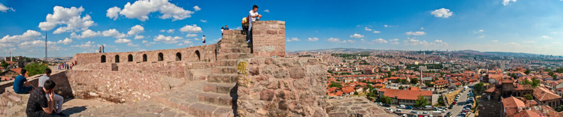 Naklejka na ściany i meble Panoramic view of Ankara Castle (Kalesi). It is a fortification from the late antique / early medieval era in Ankara, Turkey. 360 degree view of the capital of Turkey. Tourists on the walls of the man