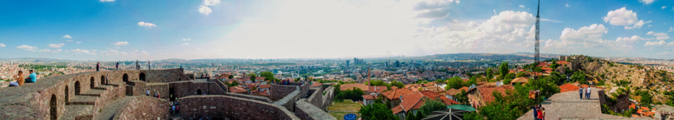 Fototapeta na wymiar Panoramic view of Ankara Castle (Kalesi). It is a fortification from the late antique / early medieval era in Ankara, Turkey. 360 degree view of the capital of Turkey. Tourists on the walls of the man