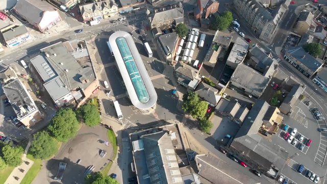 Aerial footage of the Leeds town of Pudsey in West Yorkshire, England showing typical British streets and business taken on a sunny bright summers day.
