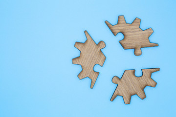  Wooden jigsaw puzzle on a blue background