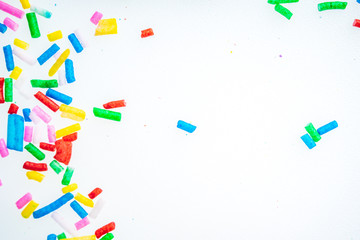 Colorful candy sprinkles close up for birthday cake on white background