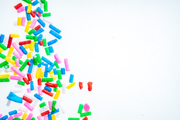 Colorful candy sprinkles close up for birthday cake on white background