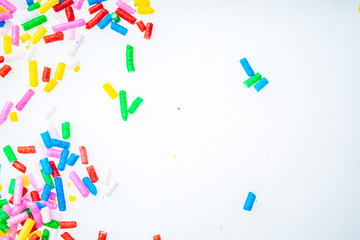 Colorful candy sprinkles close up for birthday cake on white background