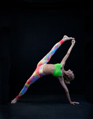 Mature woman in half moon yoga pose. 