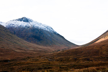 Hiking through the scottish mountains on a sunny day