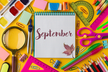 Composition with different school stationery on color background.