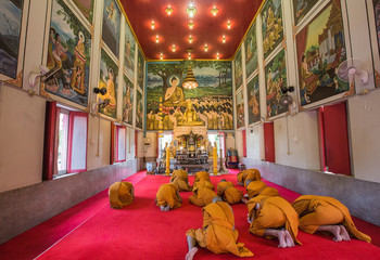 Monks pay respect to Buddha Statue in Wat Rat Bamrung (Wat Ngon Kai) - Samut Sakhon, Thailand