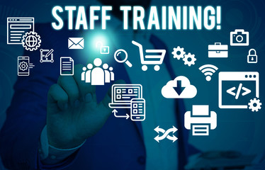 Conceptual hand writing showing Staff Training. Concept meaning learn specific knowledge improve perforanalysisce in current roles Male human wear formal suit presenting using smart device