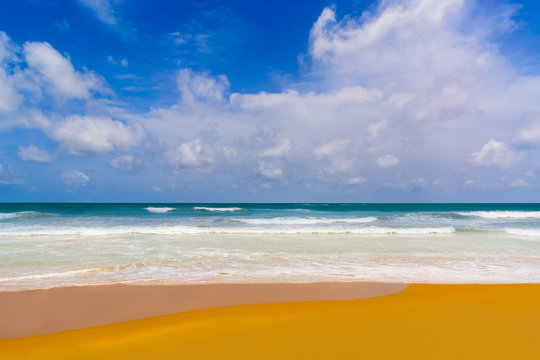 Sea Beach in the Sunny Daylight and Sky with Clouds. Mount Lavinia Beach, Sri Lanka.