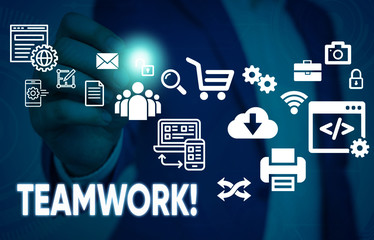 Conceptual hand writing showing Teamwork. Concept meaning combined action of group especially when effective and efficient Male human wear formal suit presenting using smart device