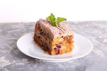 carrot cake decorated mint on a white plate