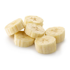 Peeled banana slices isolated over a white background.