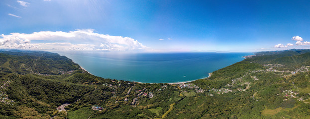 Naklejka na ściany i meble Air drone 360 view - on a mountain road near the village of Volkonka (South of Russia, the Caucasus) on a summer day. Not far away - the Black Sea