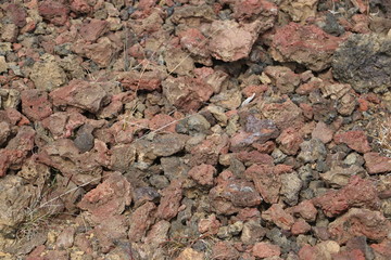 many broken volcanic red rocks 