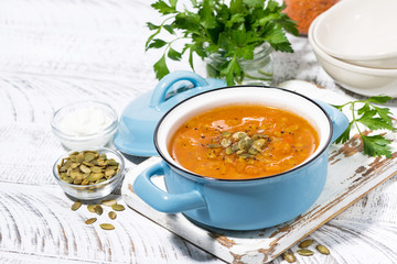 healthy lunch. spicy pumpkin soup with lentils in a saucepan