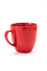 red ceramic mug on white background
