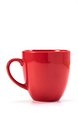 red ceramic mug on white background