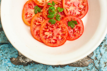 tomatoes salad (carpaccio, sliced ​​raw vegetables). food background. top view. copy space