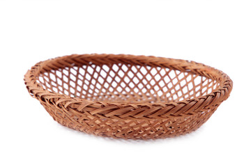 Obraz premium Empty wicker basket isolated on a white background