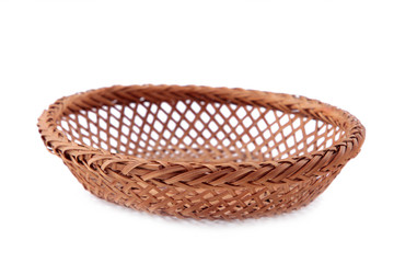 Empty wicker basket isolated on a white background