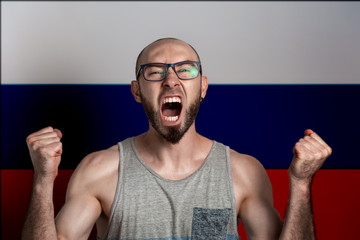 Emotions of anger and indignation. The man in glasses clenched his hands into fists and shouted. In...