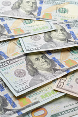 Background from chaotically lying of notes for one hundred dollars.