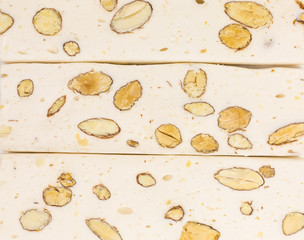 background of white nougat with almonds