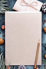 Christmas background with blank notebook surrounded by Christmas decorations. Letter to Santa or...