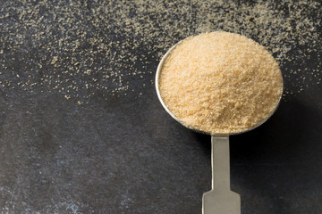 Onion Powder Spilled from a Teaspoon