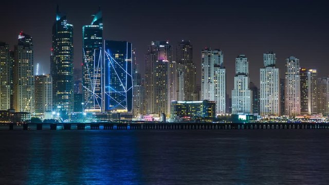 Scenic view of Dubai Marina Skyscrapers, night skyline, View from Palm Jumeirah, United Arab Emirates. Time lapse. 4K.