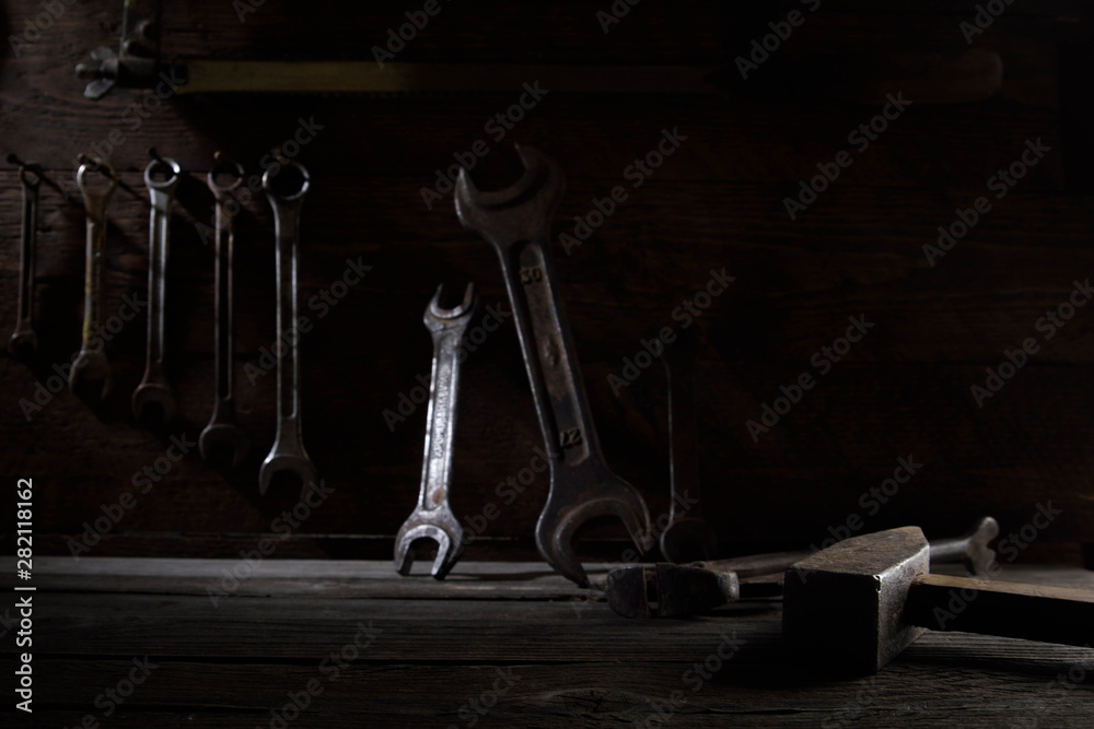 Sticker Different workpieces on a wooden background. Hedge wrenches keys, hammer