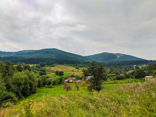 Fototapeta na wymiar Carpathian hills during the rain with dramatic clouds