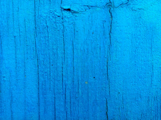 texture of old painted shabby rustic wooden fence made of planks, with rusty nails, grunge background