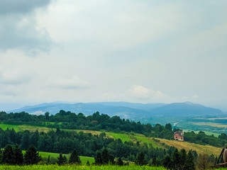 Carpathian hills during the rain with dramatic clouds