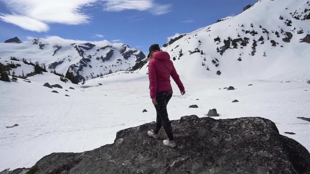Slow Motion: Woman Admiring Beautiful Snowy Landscape on a Sunny Day in Vancouver, Canada