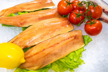 Fish on ice. The counter of the fish shop. Showcase for the demonstration of seafood. Maintaining the correct temperature of seafood storage. Fresh salmon. Fish shop. Fish trade.
