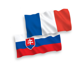 National vector fabric wave flags of France and Slovakia isolated on white background. 1 to 2 proportion.