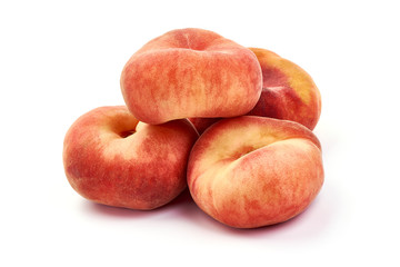Flat Peaches, ripe nectarines, isolated on white background