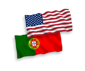 National vector fabric wave flags of Portugal and USA isolated on white background. 1 to 2 proportion.