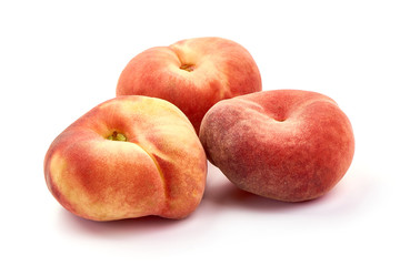 Flat Peaches, ripe nectarines, isolated on white background